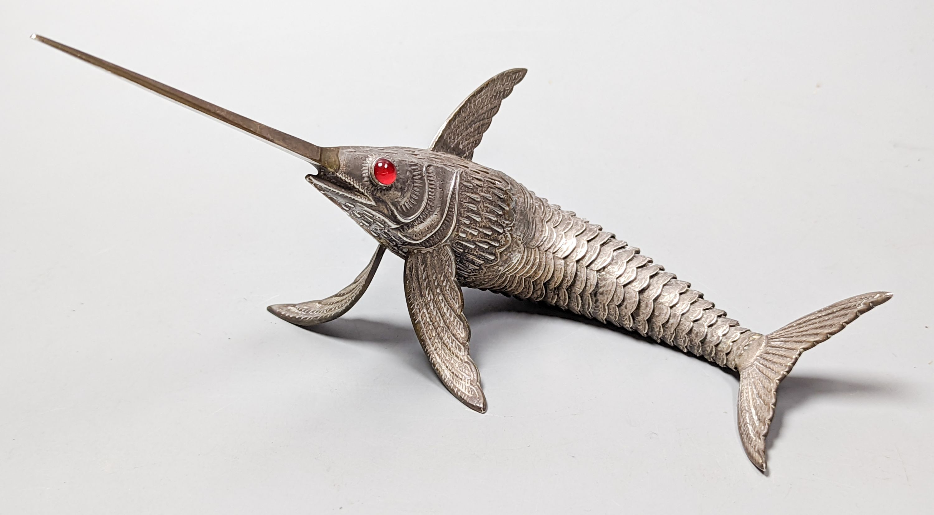 A 20th century Spanish articulated model of a swordfish, with red glass eyes, approx. 26.5cm, gross weight 118 grams.
